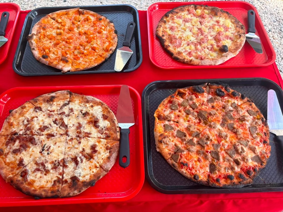 Buffalo chicken, Hawaiian, white and sausage specialty apizzas from Rollin Dough wood fired trailer Connecticut
