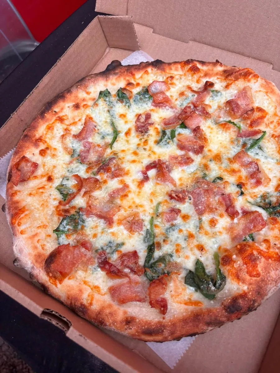 Bacon and spinach white apizza from Rollin Dough wood fired pizza trailer Guilford CT