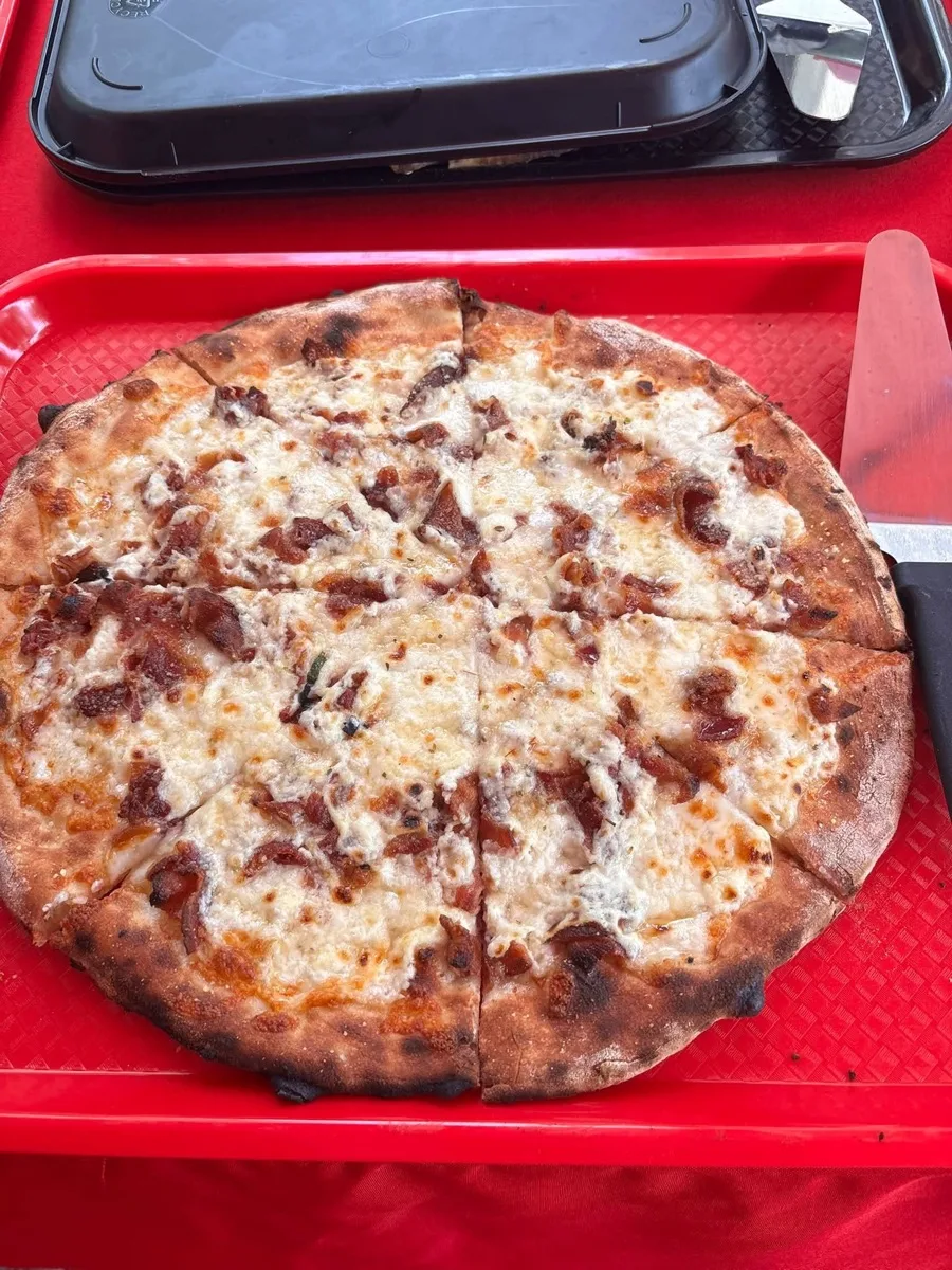 Wood fired cheese apizza served fresh on the tray at a Connecticut pizza catering event
